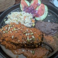 Chile relleno with garbanzo pastor stew and red sauce at Arte Sano in Holbox