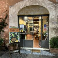 Lovely library upon entering, restaurant is to the left    at Bibliothe in Rome