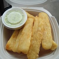 Yuca fries with a delicious house made garlic sauce, order X2 of the sauces! You are going to need it! This is a must have! at The Dragonfly in Ocala