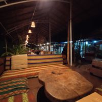 Seating area in the restaurant at Joy in Candolim