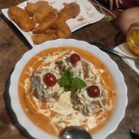 Brown rice balls in a creamy cheesy sauce. Vegan option available. at Joy in Candolim