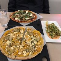 The harvest without mushrooms and artichoke instead.the chorizo pizza . Harissa at Virtuous Pie in Toronto