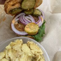 Inside Firecracker Chik’n Sandwich. Red onion, bread and butter pickles, kimchi, sriracha aioli   at Kelley Farm Kitchen in Harpers Ferry