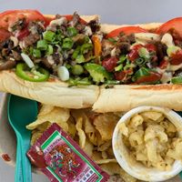 Philly with chips and mac. Best cheeze ste'k ever! Mayo, cracked black pepper, grilled seasoned seitan, onions, mushrooms, green peppers, tomato, & melted cheese. at Kelley Farm Kitchen in Harpers Ferry