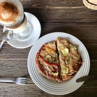 Two vegan pizzas and a cappuccino with almond milk at Sattvika Eco Panaderia in San Andres Cholula