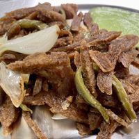 Carnitas vegetarianas, con guacamole y frijoles refritos.  at Yug in Mexico City