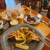 Club sandwich with French fries.  Side of marinated Chipotle peppers. at Yug in Mexico City