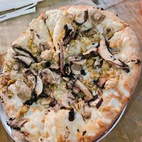 Small pizza with olive oil, vegan cheese, tempeh, portobello mushrooms, mushroom trio, and roasted garlic   at Mellow Mushroom in New Albany