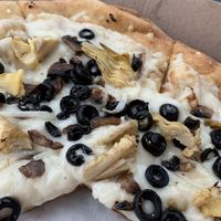 build your own pizza with oil and garlic base, extra vegan cheeze, mushrooms, olives, onion, and artichoke hearts omnomnomnomnom   at Mellow Mushroom in Fayetteville
