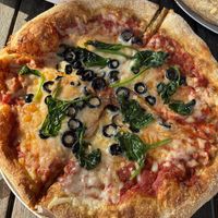 Pizza with vegan cheese, olives and spinachh  at Mellow Mushroom in Beaumont