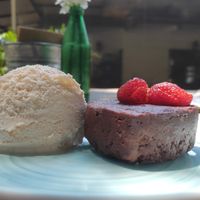 Raw Vegan Brownie with orange (and mezcal?) flavoured icecream. at Cafetería Tambien in Puebla