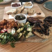 ‘The Allotment’: sweetcorn fritters, broad bean radish and beetroot salad, pesto Jersey royals, puy lentils, mushrooms on toast, chili hummus, tomato chutney  at The Windmill in Macclesfield