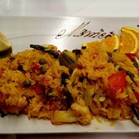 Vegan Paella served at table at Monica in Tenerife