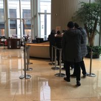 Information counter: show ID and get QR code for elevator access at The Flow in Shanghai