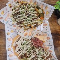 Carne asada fries and chalupas at Nissi Vegan in Austin