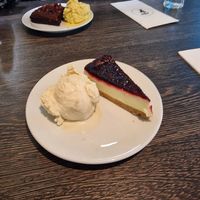 Lemon & blueberry cheesecake with caramel sauce and raspberry brownie with vanilla ice cream at Franco's in Port Talbot