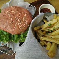 Vegan hamburger with beet and lentil patty, and pink beet-infused bun at The Open Kitchen in Monteverde