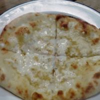 Garlic bread with vegan cheese at Rustico in Hastings