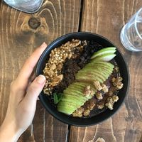 Smoothie bowl with walnuts, apples and mulberries at A.VO.KA.DO in Malmo