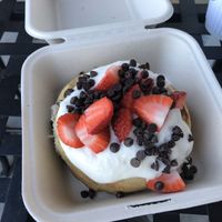 Cinnamon roll with cream cheese frosting, strawberries, and chocolate chips  at Cinnaholic  in Knoxville