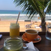 Local porridge, fresh juice and coconut cappuccino with a view. at Salty Swami's in Hikkaduwa