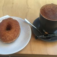 Vegan cinnamon donut and medium almond cappuccino 🌱 at Milk Belly in Fremantle