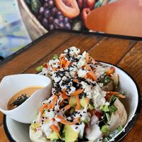 pita pocket with greens, avocado, almond cheese, avocado, etc at Peace & Bowl in Playa Del Carmen