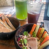 Beet hummus, infused water and a coffee from nearby coffee shop.  at Peace & Bowl in Playa Del Carmen