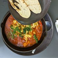 Vegan shakshuka  - tofu baked in spicy tomato sauce with cumin, fresh dill and garlic grilled ciabatta at Moondog in Key West