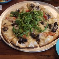 The arugula mushroom tomato pizza with remains of the grilled veggie charcuterie at Moondog in Key West
