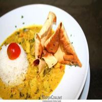 Basil-tofu curry with fresh parsley and yogurt with basmati rice on the side. 
 at Lei e Lui in Berlin