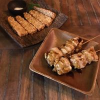 The Tempeh apps (the one on the stick was great, the other one is dry and not worth ordering)  at Cafe Bali Campur in Tokyo