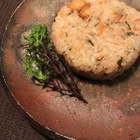 Mushroom tofu fried rice served with a green spice dusting on the side at Natural House Pumpkin in Hakuba