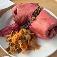 Falafel wrap with beet hummus. Added kimchi    at The Happy Pear in Greystones