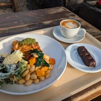 Lasagna and salad with a coffee and bounty bar at The Happy Pear in Greystones