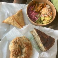 vegan quiche, spinach pastry, veg samosa, and some of the salad options at The Purple Carrot in Malton