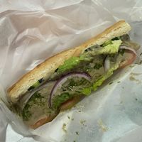 Hummus & Veggie sandwich - dripping with canola oil  at Namaste in Caye Caulker