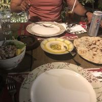 Hummus, yalanji and tahin salad with delicious bread! Paper straws are used!  at Sufra in Amman