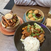 Tempura edamame and sweet potato fries, momos, sweet and sour tempura chicken with ricee  at Nooch in Bern