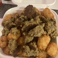 Tater tots smothered in breakfast sausage   at The BE-Hive in Nashville