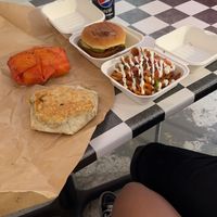 Pizza crunch wrap, taco crunch wrap, Nashville chicken sandwich and nacho waffle fries.  at The BE-Hive in Nashville