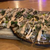 Amazing, delicious, healthy, and unique vegan pizza at Vegan Cave at Vegan Cave Tanoor Pizza in Vancouver