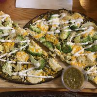 Pesto pizza at Vegan Cave Tanoor Pizza in Vancouver