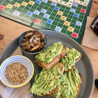 Avo toast with a side of scrabble! at Fuzzy Wombat's Kitchen in Port Noarlunga