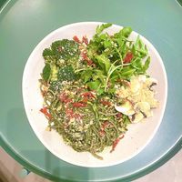 Bowl with pesto noodles. Arugula, and broccoli  at Bohl in Barcelona
