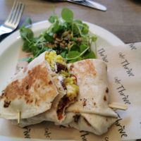 Sausage burrito (I bit into it to excited before taking a photo lol) at Cafe Thrive in Bournemouth