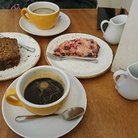 Courgette cake, raspberry scone and coffees. at Julia Bakery in Malaga