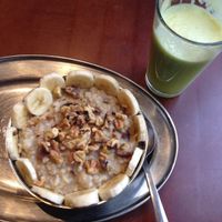 vegan oatmeal with walnuts and banana and a fresh pressed green juice at Green Sage Cafe - Broadway in Asheville