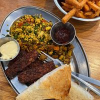 Woodstock breakfast plate with a side of sweet potato fries. Loved that tempeh bacon!   at Green Sage Cafe - Broadway in Asheville