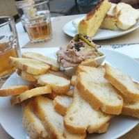 Vegan fois gras and behind tortilla with potatoes. at Cafe Madrigal in Valencia